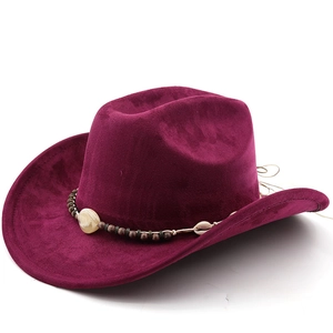 Detail of dark purple suede cowboy hat with ethnic beaded band and decorative stone