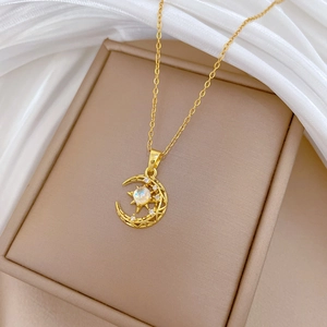Elegant gold crescent moon and star necklace with opal stone and diamonds on silk