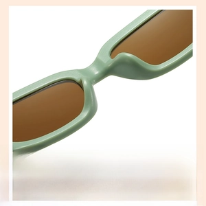Detail of integrated nose pads on light green kids sunglasses for comfortable fit