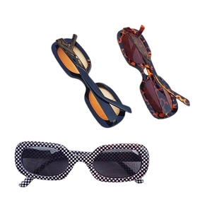 Retro oval sunglasses in leopard, checkerboard, and orange tints on a white background