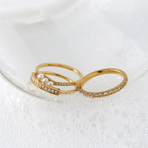Exquisite gold pearl and diamond ring set featuring elegant stacking bands for women
