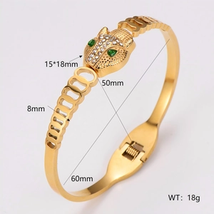 Vintage gold stainless steel leopard head bangle with emerald eyes and cubic zirconia