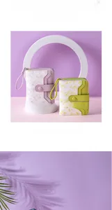 Detailed view of floral women's wallet with zipper closure and snap strap in lavender purple
