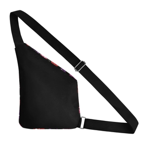 Detail of black pumpkin crossbody bag with adjustable strap and purple abstract print