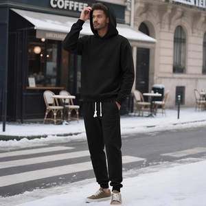 Men's black waffle texture tracksuit with hooded sweatshirt and drawstring joggers