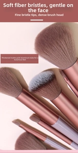 Detail of 13-piece soft fiber makeup brush set with rose gold matte aluminum handles
