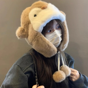 Cute penguin-themed plush earflap hat in brown and white with decorative pom-poms