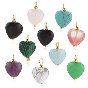 Detailed view of various heart-shaped gemstone pendants with gold metal bails on white background