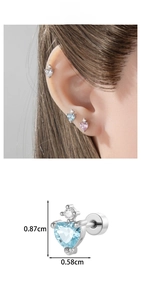 Detailed view of heart-shaped zircon cartilage studs with precise size measurements