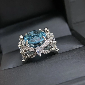 Macro detail of high-quality 18k silver plated ring with large blue gemstone
