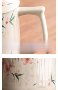 Detail of widened anti-scald handle on ceramic peach blossom mug with floral pattern