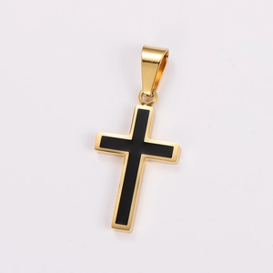 Close-up of a gold cross pendant with black inlay and polished stainless steel finish