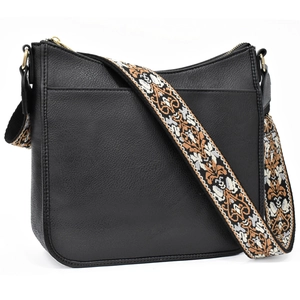 Detail of black lychee grain leather bag with bohemian jacquard embroidery strap