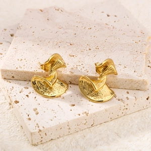 Abstract wavy 18K gold plated stainless steel earrings on beige stone background