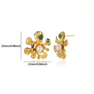 Detail of flower earrings with white pearl and green zircon, size 25mm by 22mm