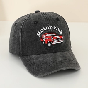 Detail of vintage car motor club embroidery on washed denim kids baseball cap