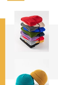 Close-up of colorful ribbed knit beanies showing texture and various color options