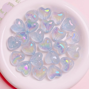 Luminous heart-shaped beads in light blue with starry UV glow effect for DIY jewelry
