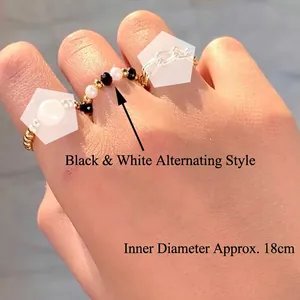 Bohemian stainless steel ring set with black beads, faux pearls and gold chain links