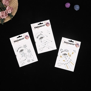 Three packs of decorative facial rhinestone stickers in clear and gold on a black background
