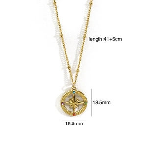 Detail showing 18.5mm compass pendant with colored diamonds and 41cm gold bead chain