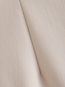 Macro photography showing the beige coarse weave fabric texture and cotton linen details