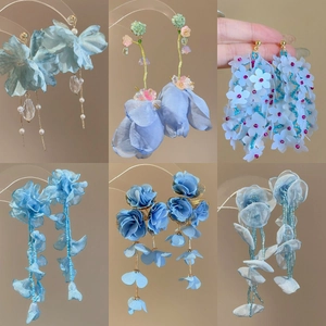 Blue chiffon flower and bead tassel earrings in various styles for a fresh vacation look