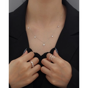 Macro detail of S925 sterling silver star pendant necklace with sparkling zircon stones
