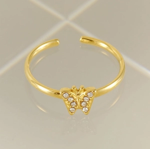Macro view of golden butterfly ring with white zircon stones and adjustable band