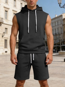 Close-up of black waffle textured sleeveless hoodie and shorts set with white drawstrings