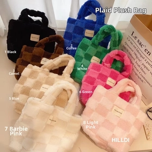 Pile of colorful waffle texture fleece bucket bags in eight various plush color options
