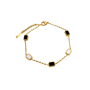 Elegant gold titanium steel bracelet with black and white rectangular charms and beads