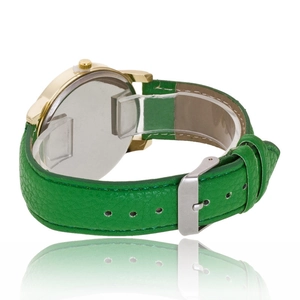 Detail view of quartz watch featuring green leather strap and gold metal case with back case