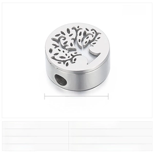 Macro shot of 15mm stainless steel Tree of Life pendant for DIY bracelets and necklaces