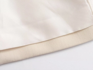 Macro view of beige cotton blend fabric layered with glossy twill satin texture