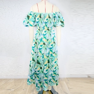 Detail view of tropical floral print ruffle tiered skirt and elastic smocked back design