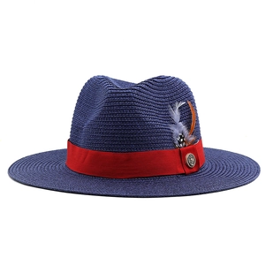 Navy blue woven fedora sun hat with red ribbon and feather detail for beach vacation