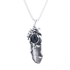 Punk style feather pendant necklace with black gemstone and vintage silver texture