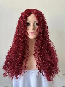 Detail shot of long curly burgundy wig with dense wave texture on a model head stand