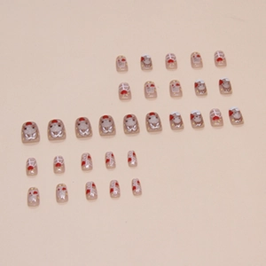 Detail of pink press-on nails featuring cute hand-painted rabbits and red hearts