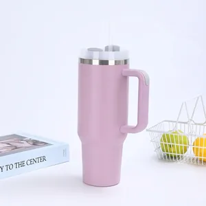 Detail showing 40oz purple insulated tumbler with ergonomic handle and straw on white background