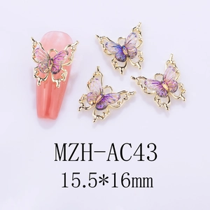 Macro shot of 15.5x16mm laser gradient butterfly nail art charm with gold metal edging
