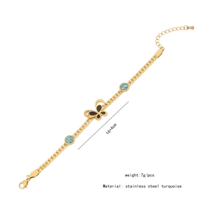 Detail of butterfly necklace with green turquoise stones and size specs on white background
