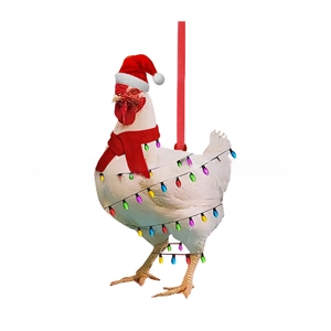 Close-up of rooster Christmas ornament with red hat and scarf for festive decoration