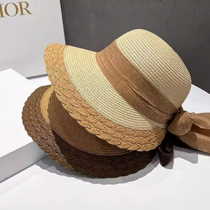 Straw sun hats for women with wide brim, scalloped edges and elegant silk ribbon bows
