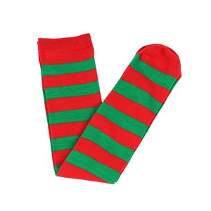 Detail of red and green striped knee-high Christmas socks with ribbed cuffs on white background