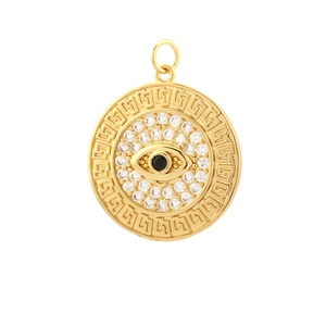 Detailed view of gold evil eye pendant with clear zircons and Greek key pattern