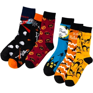 Detailed macro shot of six cotton Halloween socks featuring pumpkin and bat knit patterns