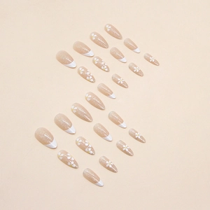 Almond shaped press-on nails with elegant white French tips and glitter floral patterns