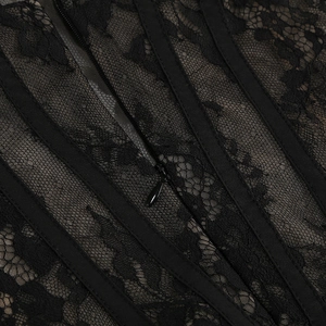 Detailed macro view of black lace evening dress with corset boning and invisible zipper